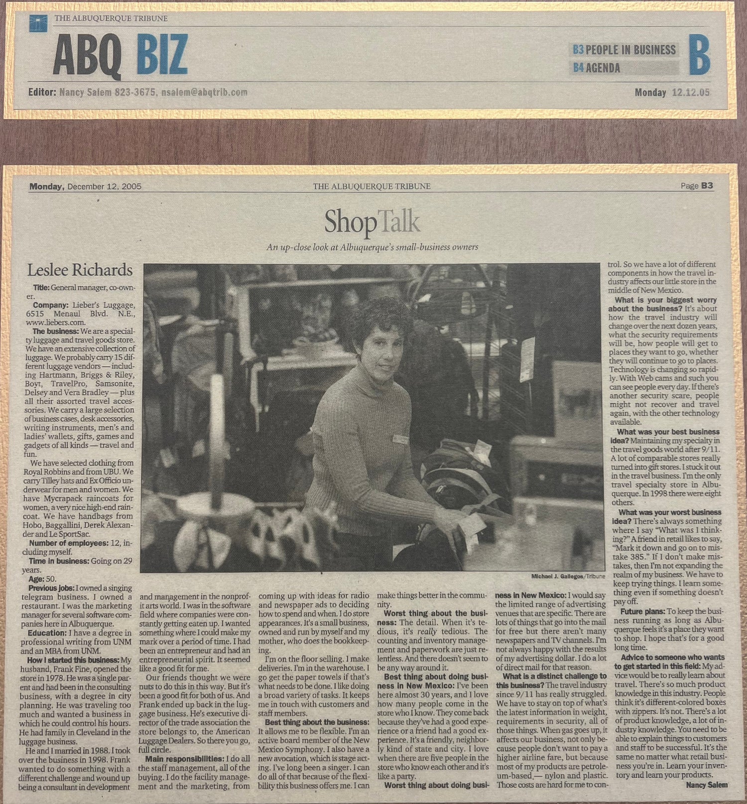 Newspaper with a black and white photo and text on a wooden surface