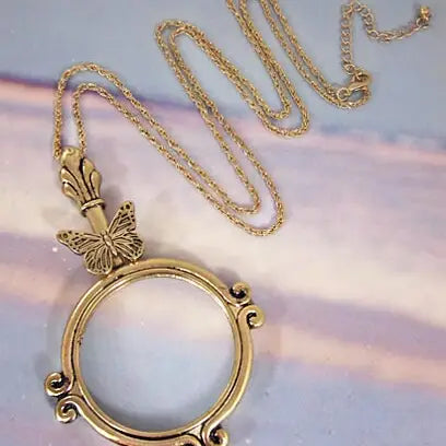 The Tizana 6x Magnifying Glass Pendant Necklace Butterfly Antique Gold