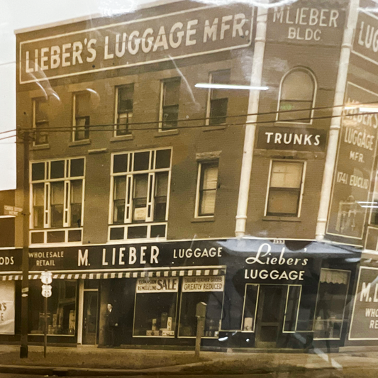 The original M. Lieber Luggage building on Euclid Avenue, Cleveland Ohio — showing the Lieber's Luggage MFR. rooftop sign and M. Lieber BLDC corner tower, wholesale and retail storefronts at street level.