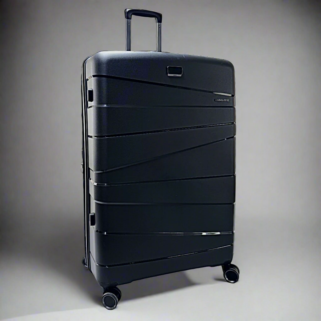 #Black suitcase with a textured surface on a white background