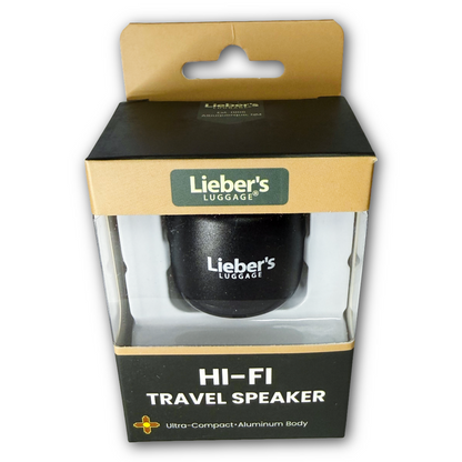 Lieber's Luggage Hi-Fi Travel Speaker in its original retail packaging, featuring a black speaker inside a clear plastic window box with a gold and black cardboard hanger.