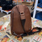 ili New York Leather Sling Pack